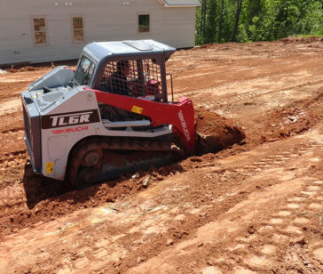 compact-track-loader-Takeuchi-TL6R-grading-dirt-landscaping