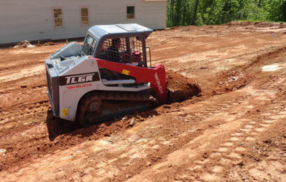 compact-track-loader-Takeuchi-TL6R-grading-dirt-landscaping