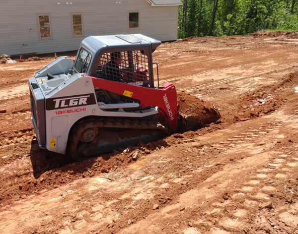 compact-track-loader-Takeuchi-TL6R-grading-dirt-landscaping